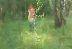 Thin brown head slut takes off her clothes and sucks dick in the woods
