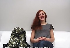 Redhead teen fucks herself with a huge dildo on a casting