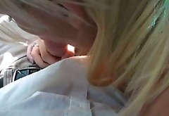 Sexy blonde harlot with big boobs gives her client a nice blowjob