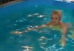 Granny in the pool with dildo inflatable