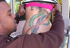 Curvy tattooed bitch Tori Lux gets her boobs sucked by black guy