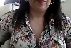 Carmen candid on webcam in her office