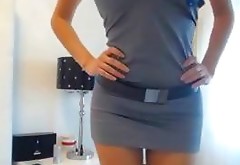 Busty chick in a blue dress rubbing her hot pussy