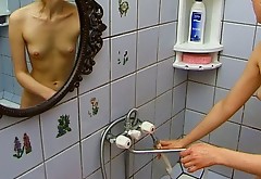 Skinny Russian girl with small tits taking shower in the bathroom