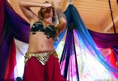 A belly dancer puts on a show before going to work on his cock