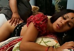 Two guys fuck Indian brunette lady Tina on the couch