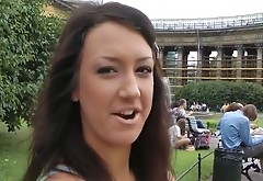 Adorable brunette girl gives a head on a red square