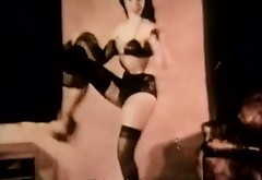 Brunette Witch Entices Audience in Lingerie (1950s Vintage)