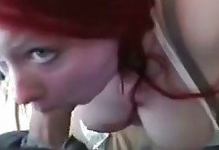 Red haired amateur chick with big boobs sucks curved dick on a pov camera