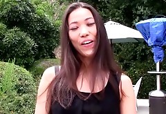 Sexy bosomy Asian brunette gal in black stockings masturbates outdoors