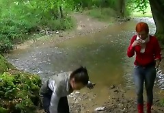 Couple of horny chicks get horny and start a fight in mud lake