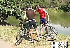 This hot young guy stops to help an injured cyclist, he takes him back to his place to help make it all better. They get home and began to play with o