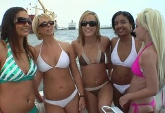 Bikini babes with great bodies having fun on a boat