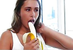 Hot young girl tempts guy with banana eating