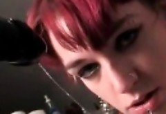Trashy redhead teen sucking large dildo