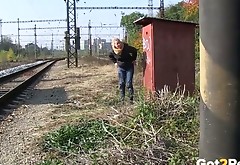Dumpy brunette chick pisses near rail-track outdoors