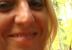 Whorish blonde slut is fingering her snatch in the park in front of the viewers