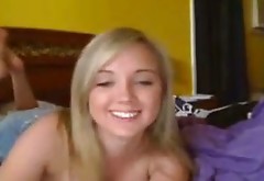 Smiling pretty blonde girlie flashes and plays with her nice big boobies