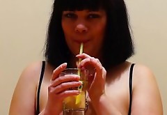 Girl with by a pussy hairy, pissing into a glass and drink their urine