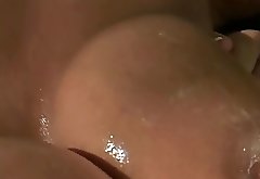 Horny slut sucks cock and gets her titty fucked in bed