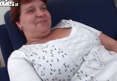 Fat granny Renate is playing with huge red sex toy