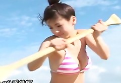 Cheerful Japanese babe Aki Hoshino has fun on the beach