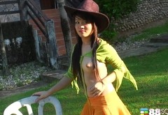 Asian girl with the cowboy hat play around with her hairy pussy