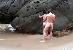 Torn slut Carol Sousa is butt fucked doggy style right on a beach