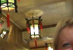 Blonde chica is showing her appetizing tits in a Chinese Restaurant