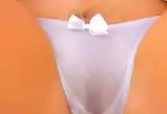 Busty black haired chick in white panties pleases her hot kitty with fingers