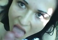 Brunette with charming eyes gives blowjob outdoor