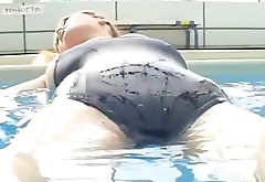 Buxom brown head Yoko Matsugane bathes in a pool squeezing her twin