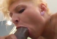 Busty blonde mom Chiara takes a shower and sucks a black schlong