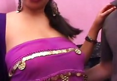 Horn-mad Indian chick in traditional gown kneels down to suck a dick