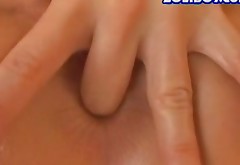 Lissom hot and kinky black haired gal Joanne fists and fingers pussy