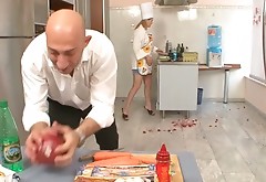 Tough cook punishes his assistant in the kitchen