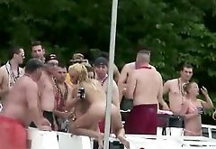 many Teens dancing nude at public party