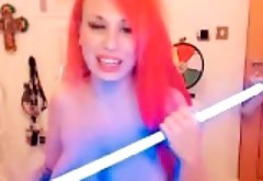 Big-tits redhead rubs clit on webcam
