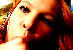 Superb redhead Russian honey Yulia sucking a massive penis with lust by Erotic Russians