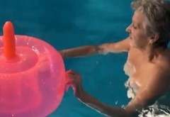 Granny in the pool with dildo inflatable