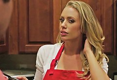 Blonde housewife in the kitchen