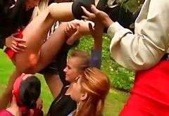 Pissing lesbians in group at park