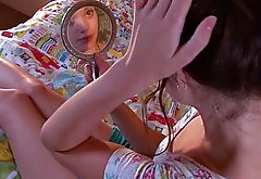 Perky teen masturbates with her mirror