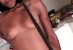 Naked ebony tied sex slave pissing in a glass