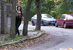 Shameless black haired girl pisses right at the street