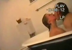 Impressively hot busty lesbos please each other in the bath at night