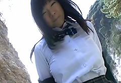 Japanese busty babe strips outdoors teasing with her gorgeous body