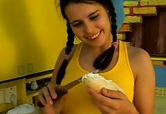 Chubby teen with hairy pussy is seduced and fucked in a kitchen