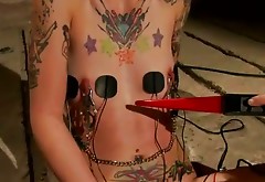Flat chested tattooed whore gets her pussy fucked with wired stick